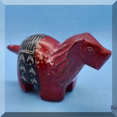 D80. Soapstone carved lion painted red. 2” x 4”w - $8